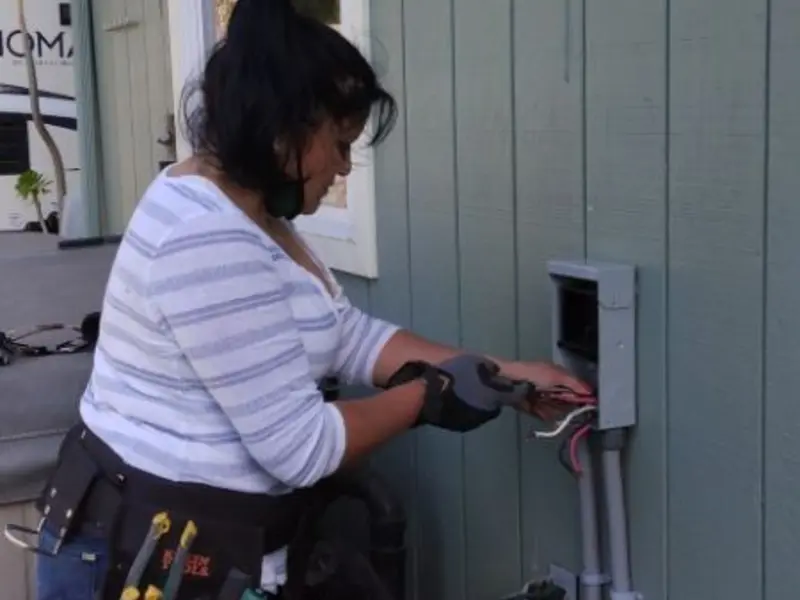 Licensed electrician wiring an exterior subpanel in Paradise